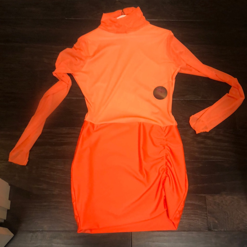New dress orange never worn with tags..